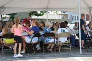 Guests enjoying their free lunches from Shove It Pizza and Kona Ice
