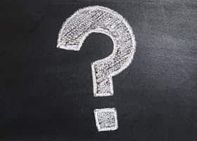 A conceptual image featuring a question mark drawn on a chalkboard, ideal for problem-solving contexts.