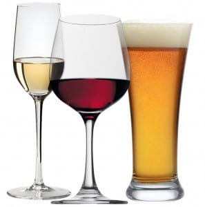 a pair of wine glasses with white and red wine and a tall glass of beer.
